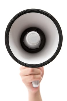 Female hand holding a megaphone. Isolated on a white background.