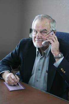Senior business executive talking on cell phone 