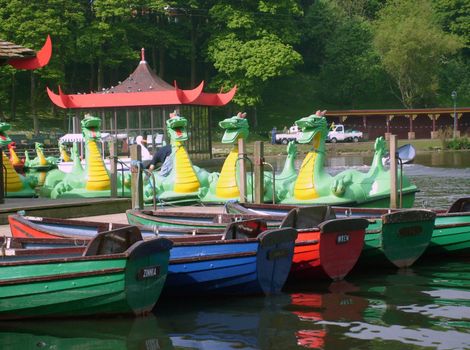 Dragon boats on boating lake in Peasholm Park, Scarborough, England.