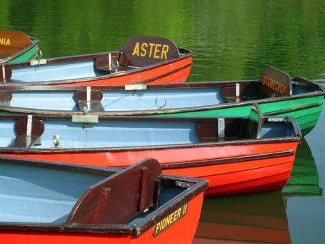 Colorful boats on boating lake in Peasholm Park, Scarborough, England.