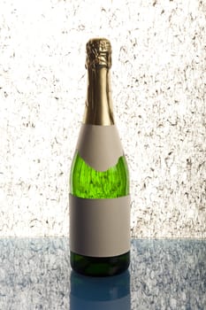 Beautiful big green bottle of chilled champagne on a delicate background