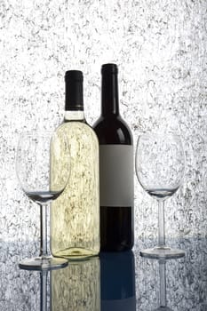 Beautiful bottles of chilled wine on a delicate background
