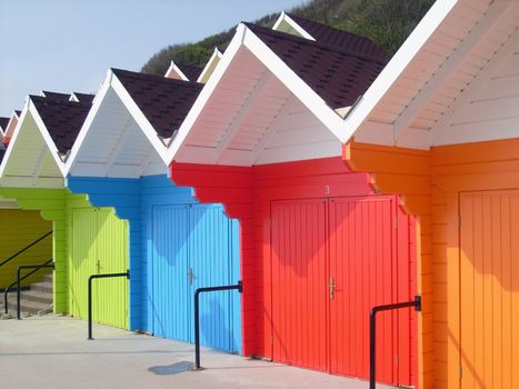 Colorful beach chalets by seaside, Scarborough North Bay, England, U.K.