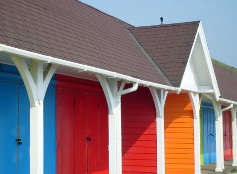 Colorful beach chalets by seaside, Scarborough North Bay, England, U.K.