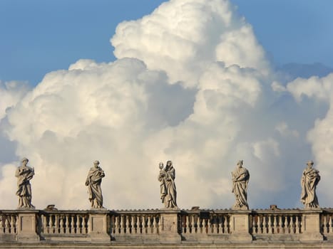 statues in s.pietro in rome whit clouds
