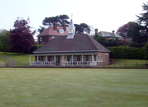 English village bowling green and pavilion on summers day.