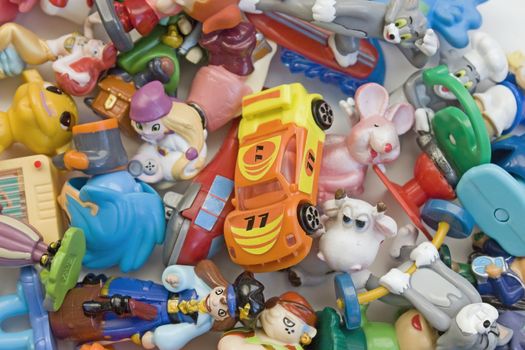 Many multi-colored, bright, small toys.