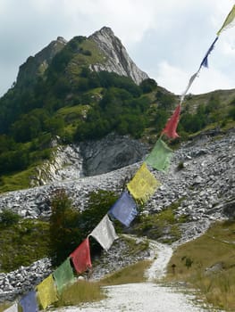 four tibetan flags and mountain