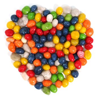 Heart made of multi-coloured sweets with raisin 1, isolated on white, (look similar images in my portfolio)