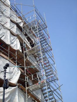 Overview of building site as construction taking place.