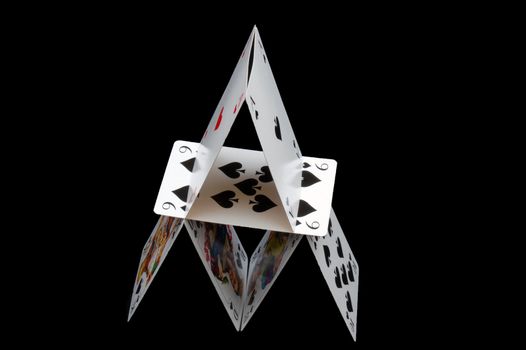 tower of cards isolated on the black background