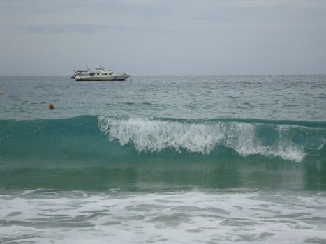 Sea azure, motorboat, waves Sanya Yalong Bay