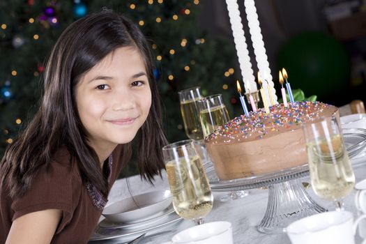 Little girl ready to blow out her birthday cake candles