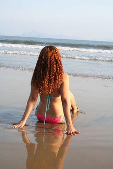 Beautiful young woman on beach