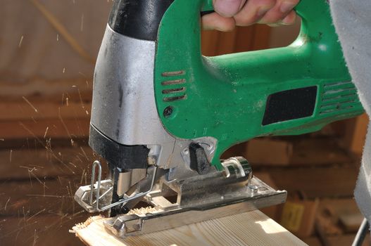cutting boards for cladding the walls of a wooden house saws jigsaws 
