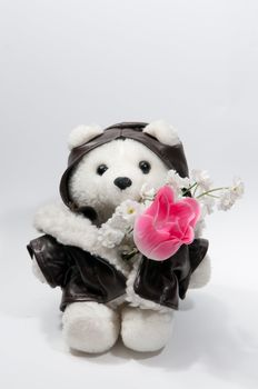 Teddy bear with a bunch of flowers