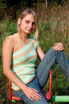 sunburned girl in sleeveless top in the park
