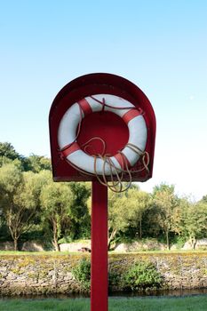 a lifebuoy on the river edge in castletownroche a beautiful irish town in the country
