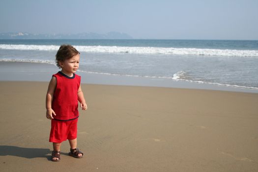 Little boy playing on the beach