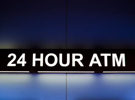 24 Hour ATM sign light up at night