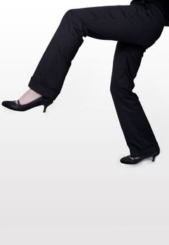 female in a suit doing odd walk
