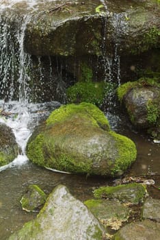 scenic waterfall with the heart-shaped stone