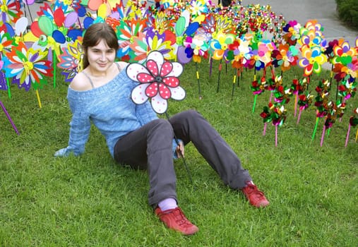 A portrait of a beautiful young girl holding a pinwheel