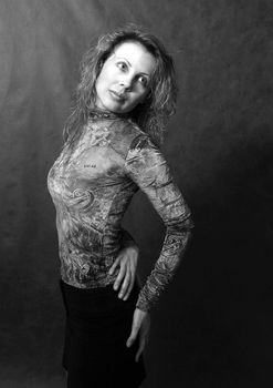 Portrait of the beautiful woman in studio revolved to the right. b/w
