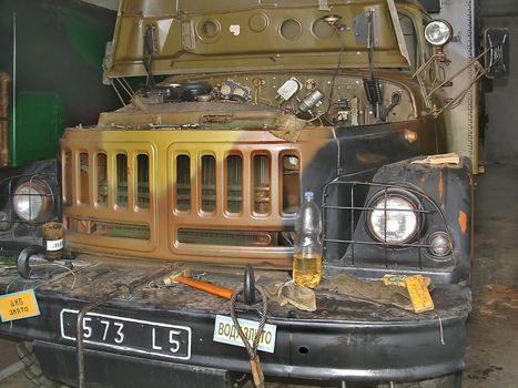 Military Russian car ZIL - 131 in boxing on seasonal preventive repair