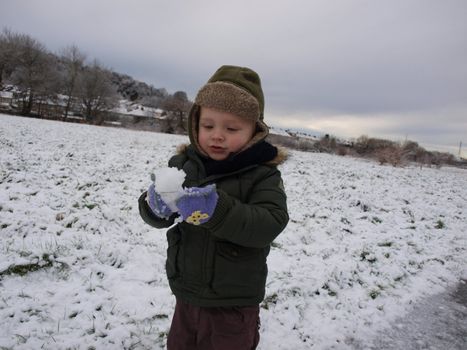 child playing on the snow