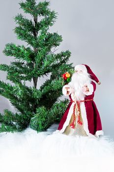 Happy Christmas toy Santa. It is isolated above a white background