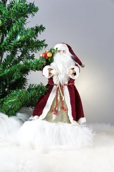 Happy Christmas toy Santa. It is isolated above a white background