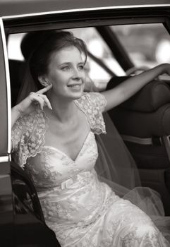 Beautiful the bride in car