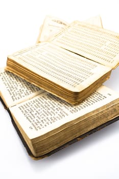 Three opened old books isolated on white background