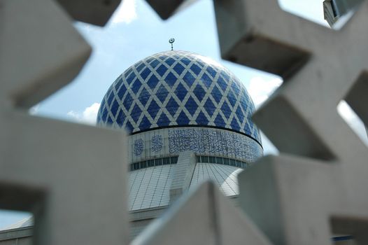 Famous mosque in Malaysia view from a star shaped frame