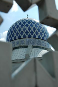 Famous mosque in Malaysia view from a star shaped frame