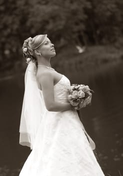 Portrait of the beautiful bride with a bouquet