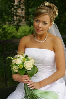 Portrait of the beautiful bride with a bouquet