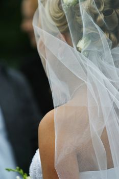 The bride looks in a trace to the groom