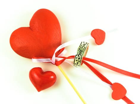 Valentines Day hearts and ring on white background.