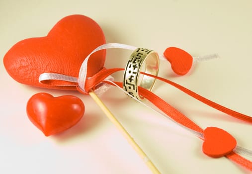 Valentines Day hearts and ring on white background.