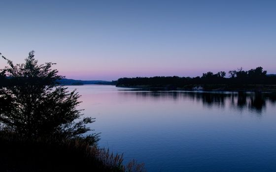 Dawn on the Missouri River from the bald eagle observation park near Fort Randall Dam, South Dakota.