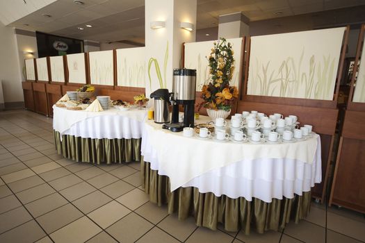 table full of salads, bread and coffee