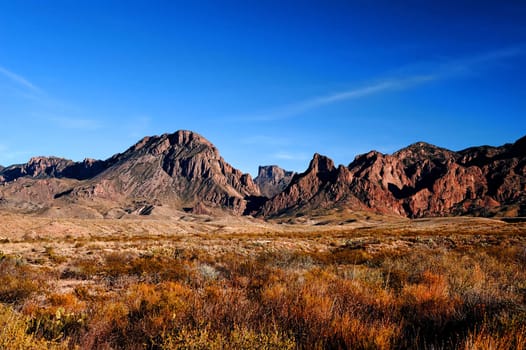 Image of rocky red mountains against blue sky