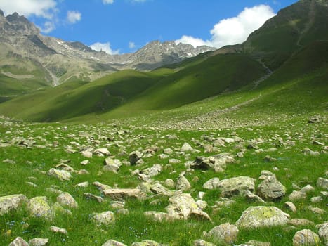 Scattered stones a valley in mountains of Caucasus.
