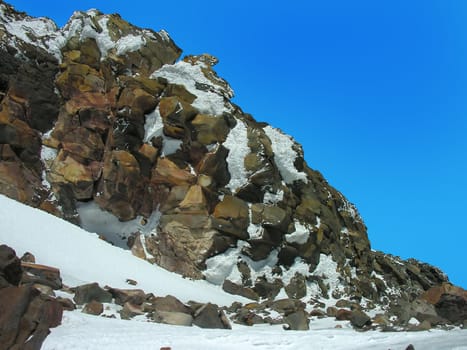 Rock on a background of the blue sky.          