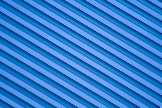 Blue diagonal stripes bacground from a building.