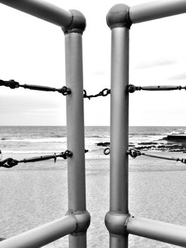 Barrier with break chain with ocean in the background.