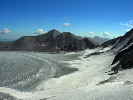 The Caucasian mountains covered with a snow          