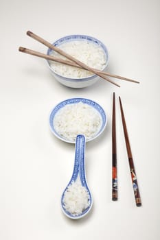 Bowl of white rice isolated on white